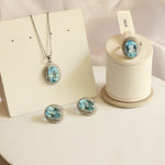 Load image into Gallery viewer, Araliya Blue Topaz Earrings Pendant and RIng Set
